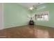 Open living space offering lots of natural light and wood flooring at 18080 W Spencer Dr, Surprise, AZ 85374