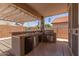 Great outdoor kitchen including a sink, mini-fridge, and BBQ grill at 18080 W Spencer Dr, Surprise, AZ 85374
