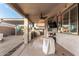 Spacious covered patio featuring outdoor kitchen with built in BBQ and outdoor seating area at 18080 W Spencer Dr, Surprise, AZ 85374