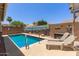 Relaxing pool with lounge chairs in private backyard at 18080 W Spencer Dr, Surprise, AZ 85374