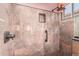 Stylish tiled shower featuring upgraded shower head and storage niche at 18080 W Spencer Dr, Surprise, AZ 85374