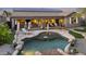 A backyard showcasing a freeform pool, patio, and outdoor seating area perfect for relaxation and entertainment at 22205 W Ashleigh Marie Dr, Buckeye, AZ 85326