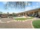 Inviting backyard features a pool, waterfall, and a well-manicured landscape at 22205 W Ashleigh Marie Dr, Buckeye, AZ 85326