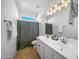 Bathroom with double sink vanity, neutral paint, and a shower with curtain at 22205 W Ashleigh Marie Dr, Buckeye, AZ 85326