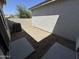 Low maintenance backyard with gravel and concrete pads, with block wall surrounding perimeter at 2539 N 148Th Dr, Goodyear, AZ 85395