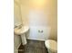 Bathroom with a pedestal sink and tiled floor at 2539 N 148Th Dr, Goodyear, AZ 85395