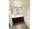 Bathroom showcasing a double sink vanity with generous mirror and a tiled shower/tub combo at 2539 N 148Th Dr, Goodyear, AZ 85395