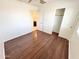 Bedroom with laminated floors, a closet and a bathroom at 2539 N 148Th Dr, Goodyear, AZ 85395