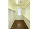 Bright walk-in closet with wooden rods and shelving, and natural light from a window at 2539 N 148Th Dr, Goodyear, AZ 85395
