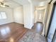 Open concept living area with wood-look flooring and tiled entryway at 2539 N 148Th Dr, Goodyear, AZ 85395
