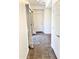 Entryway with tiled floor leads to a living area with wood-look flooring at 2539 N 148Th Dr, Goodyear, AZ 85395