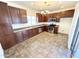 Bright and airy kitchen with stainless steel appliances, dark cabinetry and tiled flooring at 2539 N 148Th Dr, Goodyear, AZ 85395