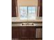 Kitchen sink with stainless steel hardware, with a window overlooking neighborhood at 2539 N 148Th Dr, Goodyear, AZ 85395