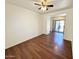 Open living room with wood-look flooring, and access to the backyard at 2539 N 148Th Dr, Goodyear, AZ 85395