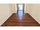 Vacant living room with sliding glass door and wood-look flooring at 2539 N 148Th Dr, Goodyear, AZ 85395