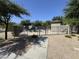 Gated community pool with lounge chairs at 2539 N 148Th Dr, Goodyear, AZ 85395