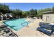 Community pool with lounge chairs and blue accents at 2539 N 148Th Dr, Goodyear, AZ 85395