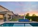 Expansive backyard with a sparkling pool, lounge area, and lush green lawn, perfect for outdoor living at 2854 E Virginia St, Mesa, AZ 85213