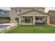 Inviting backyard with a covered patio, outdoor seating, green lawn, and a pool at 2854 E Virginia St, Mesa, AZ 85213