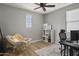 This home office space features a comfortable chair, sleek wooden floors and natural light at 2854 E Virginia St, Mesa, AZ 85213
