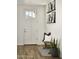 Welcoming entryway with a bench, decorative pillows, tiled floors, and stylish wall art at 2854 E Virginia St, Mesa, AZ 85213