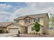 Inviting two-story home featuring a neutral color palette and a well-maintained front yard at 2854 E Virginia St, Mesa, AZ 85213