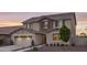 Charming two-story home featuring a two-car garage, landscaped yard, and inviting front entrance at 2854 E Virginia St, Mesa, AZ 85213