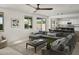 Open-concept living room with seamless flow to kitchen, dining, and outdoor pool area at 2854 E Virginia St, Mesa, AZ 85213