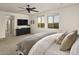 Bright main bedroom suite with large windows, ceiling fan, and view to adjacent sitting area at 2854 E Virginia St, Mesa, AZ 85213