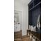 Charming mudroom with built-in bench, storage shelves, and hooks for easy organization at 2854 E Virginia St, Mesa, AZ 85213