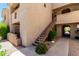 Exterior staircase to apartments with desert landscaping and convenient access at 29606 N Tatum Blvd # 245, Cave Creek, AZ 85331