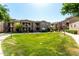 Spacious green area between apartment buildings with walking paths and community barbecues at 29606 N Tatum Blvd # 245, Cave Creek, AZ 85331