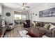 Comfortable living room with a patio view, inviting decor, and plentiful natural light at 29606 N Tatum Blvd # 245, Cave Creek, AZ 85331