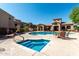 Community pool and spa with lounge chairs and seating areas for residents' enjoyment at 29606 N Tatum Blvd # 245, Cave Creek, AZ 85331