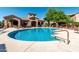 Large community pool with ample lounge seating, a perfect spot for relaxation and socializing at 29606 N Tatum Blvd # 245, Cave Creek, AZ 85331