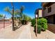 A well-maintained walkway leads to the apartment buildings surrounded by lush landscaping at 29606 N Tatum Blvd # 245, Cave Creek, AZ 85331