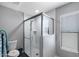 Renovated bathroom featuring walk-in shower with glass, updated fixtures, and tiled walls at 347 Leisure World --, Mesa, AZ 85206