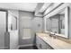 Updated bathroom with a new vanity, framed mirror, tile flooring, and walk-in shower at 347 Leisure World --, Mesa, AZ 85206
