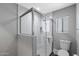 Updated bathroom with a glass-enclosed shower featuring white tile and modern fixtures at 347 Leisure World --, Mesa, AZ 85206