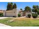 Charming single-story home featuring a well-maintained lawn, desert landscaping, and an attached two-car garage at 347 Leisure World --, Mesa, AZ 85206