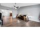 Bright living room with wood-look floors, neutral walls, a ceiling fan, and an open floor plan at 347 Leisure World --, Mesa, AZ 85206