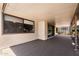 A covered patio with sliding glass doors leading inside and a view of the surrounding landscape at 347 Leisure World --, Mesa, AZ 85206