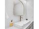 Elegant bathroom with a modern sink, golden faucet, and subway tile backsplash at 35 E Secretariat Dr, Tempe, AZ 85284