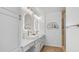 Modern bathroom featuring double vanity with marble counters, subway tiles, and gold fixtures at 35 E Secretariat Dr, Tempe, AZ 85284