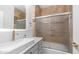 Bathroom featuring modern vanity, backlit mirror, and sliding glass shower doors at 35 E Secretariat Dr, Tempe, AZ 85284