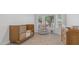 Well-lit Bedroom with crib, plush chair, and bay window at 35 E Secretariat Dr, Tempe, AZ 85284