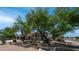 Charming single-Gathering home with mature landscaping, large driveway, and three-car garage at 35 E Secretariat Dr, Tempe, AZ 85284