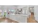 Bright kitchen with white cabinets, stainless steel appliances, and a large island at 35 E Secretariat Dr, Tempe, AZ 85284