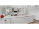 Bright kitchen with white cabinets, subway tile backsplash, modern appliances, and a large island at 35 E Secretariat Dr, Tempe, AZ 85284
