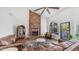 Comfortable living room featuring brick fireplace, neutral walls, and ample seating at 35 E Secretariat Dr, Tempe, AZ 85284